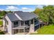 Rear view of home featuring large windows and an expansive deck at 15132 Pecos St, Broomfield, CO 80023