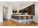 Beautiful kitchen with an island, modern bar stools, and pendant lighting above the countertop at 15132 Pecos St, Broomfield, CO 80023