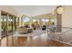 Living room featuring wood floors, large windows, and an open concept design at 15132 Pecos St, Broomfield, CO 80023