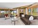 Cozy living room featuring a fireplace, comfortable seating, and sliding doors that lead to the outdoor space at 15132 Pecos St, Broomfield, CO 80023