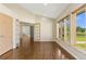 Bright room with wood floors, a sliding door, and a view of the surrounding landscape at 15132 Pecos St, Broomfield, CO 80023