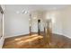 Spacious room with wood floors, skylights, and an open doorway leading to other areas at 15132 Pecos St, Broomfield, CO 80023