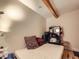 Small bedroom with hardwood floors and exposed beam at 2460 W Caithness Pl # 105, Denver, CO 80211