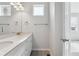 Bright bathroom with dual sinks, modern fixtures, and a neutral color palette create a clean, contemporary space at 453 Interlocken Blvd # 101, Broomfield, CO 80021