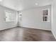 Spacious empty bedroom with hardwood floors and natural light from multiple windows at 453 Interlocken Blvd # 101, Broomfield, CO 80021