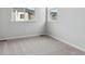 Inviting bedroom with plush carpeting and ample natural light creates a comfortable, serene space for relaxation and rest at 453 Interlocken Blvd # 101, Broomfield, CO 80021