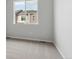 Neutral bedroom featuring soft carpet, natural light, and a minimalist design, offering a calming and inviting atmosphere at 453 Interlocken Blvd # 101, Broomfield, CO 80021