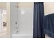Bright and functional bathroom featuring a shower-tub combination with white subway tile surround at 7212 S Blackhawk St # 1-103, Englewood, CO 80112