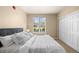 Comfortable bedroom features a large window with natural light and a closet at 7212 S Blackhawk St # 1-103, Englewood, CO 80112