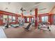 Community gym with modern exercise equipment, ceiling fans, and natural light at 7212 S Blackhawk St # 1-103, Englewood, CO 80112
