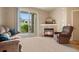 Inviting living room with a fireplace, comfortable furnishings, and a sliding glass door at 7212 S Blackhawk St # 1-103, Englewood, CO 80112