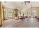 Large living room with a stone fireplace, vaulted ceilings, and an open-concept layout at 7212 S Blackhawk St # 1-103, Englewood, CO 80112