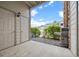 Cozy patio area with a barbecue, exterior closet space, and stone accents at 7212 S Blackhawk St # 1-103, Englewood, CO 80112