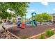 Community playground with modern equipment, located in a landscaped area at 7212 S Blackhawk St # 1-103, Englewood, CO 80112