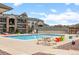 Beautiful community pool with ample seating, picnic tables, and views of the community at 7212 S Blackhawk St # 1-103, Englewood, CO 80112