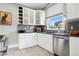 Modern kitchen with sleek white cabinets, stainless steel appliances, and updated countertops at 1452 S Emerson St, Denver, CO 80210