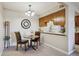 Cozy dining area adjacent to the kitchen, featuring a stylish light fixture and comfortable seating for intimate meals at 519 Wright St # 106, Lakewood, CO 80228
