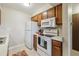 Functional kitchen equipped with essential appliances, ample cabinet space, and a clean, efficient layout at 519 Wright St # 106, Lakewood, CO 80228