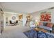 Open-concept living room with a dining area and access to the kitchen, creating a seamless flow for modern living at 519 Wright St # 106, Lakewood, CO 80228
