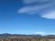 Expansive view showcases distant mountains under a clear blue sky at 519 Wright St # 106, Lakewood, CO 80228