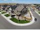 Aerial view of a two-story home with front yard landscaping in a suburban neighborhood at 15955 E Otero Cir, Centennial, CO 80112