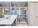 Elegant bathroom featuring a glass shower and a single vanity at 15955 E Otero Cir, Centennial, CO 80112