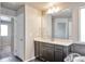 Bathroom with a vanity with white countertop, and large mirror at 15955 E Otero Cir, Centennial, CO 80112