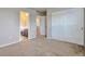 Bedroom features closet and entry to bathroom with double sink vanity at 15955 E Otero Cir, Centennial, CO 80112