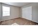 Bedroom with natural light from window and sliding closet doors at 15955 E Otero Cir, Centennial, CO 80112