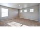Bright bedroom filled with natural light from multiple windows and neutral carpeted floor at 15955 E Otero Cir, Centennial, CO 80112