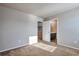 Bedroom with view of the bathroom and a doorway to other rooms at 15955 E Otero Cir, Centennial, CO 80112