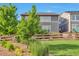 Backyard view shows the home's exterior with a small fence and landscaping at 15955 E Otero Cir, Centennial, CO 80112
