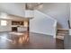 Spacious living room with hardwood floors, high ceilings, open concept layout connecting to the kitchen at 15955 E Otero Cir, Centennial, CO 80112