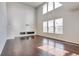 Open living room with tall ceilings, hardwood floors, and ample natural light at 15955 E Otero Cir, Centennial, CO 80112