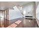 Bright living room features hardwood floors, high ceilings, and a modern entertainment center at 15955 E Otero Cir, Centennial, CO 80112