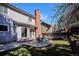 Large backyard features a stone patio and a green lawn, perfect for outdoor enjoyment at 1206 E Phillips Pl, Littleton, CO 80122