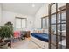 Charming bedroom offers a versatile layout, natural light, and a cozy daybed at 1206 E Phillips Pl, Littleton, CO 80122