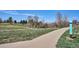 Scenic view of the paved community trail on a sunny day with blue skies at 1206 E Phillips Pl, Littleton, CO 80122