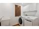 Laundry room featuring front-load washer and dryer and large utility sink at 1206 E Phillips Pl, Littleton, CO 80122