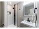 Modern bathroom featuring a walk-in shower with sleek fixtures and a gray vanity at 116 S 10Th Ave, Brighton, CO 80601