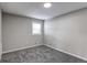 This bedroom features neutral carpet, a window, and light-colored walls at 116 S 10Th Ave, Brighton, CO 80601