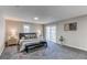 Bright bedroom with gray carpet, sliding glass door, and neutral walls at 116 S 10Th Ave, Brighton, CO 80601