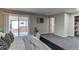 Bedroom with gray carpet, sliding glass door to an outdoor patio at 116 S 10Th Ave, Brighton, CO 80601