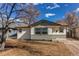 Charming single-story home featuring a combination of siding and stone accents at 116 S 10Th Ave, Brighton, CO 80601