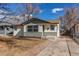 Charming single-story home featuring a combination of siding and stone accents at 116 S 10Th Ave, Brighton, CO 80601