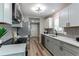 Modern kitchen featuring gray cabinets, stainless steel appliances, and sleek design at 116 S 10Th Ave, Brighton, CO 80601