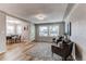 Bright living room with ample natural light, wood floors, and stylish seating at 116 S 10Th Ave, Brighton, CO 80601