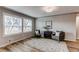 Bright living room with ample natural light, wood floors, and stylish seating at 116 S 10Th Ave, Brighton, CO 80601