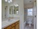 Bathroom featuring tiled counter and a shower in addition to a toilet at 5072 Meadow Mountain Dr, Broomfield, CO 80023