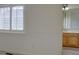 This bedroom features an entrance to a bathroom, and bright window at 5072 Meadow Mountain Dr, Broomfield, CO 80023